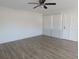 Spacious living room with wood-look floors and lots of natural light at 6026 22Nd N Ave # 5, St Petersburg, FL 33710