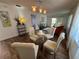 Modern dining area with glass top table and four chairs at 2363 Newburg Ln # B, Safety Harbor, FL 34695