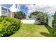 Spacious backyard with grassy lawn and privacy fence at 1745 Harbor W Cir, Largo, FL 33770