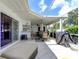 Extended patio with seating and grill at 1745 Harbor W Cir, Largo, FL 33770