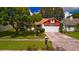 House with a red accented gable and a two car garage at 2011 Green Juniper Ln, Brandon, FL 33511