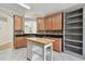 Modern kitchen featuring wood cabinets, granite countertops, and a kitchen island at 3048 Sunwatch Dr, Wesley Chapel, FL 33544