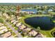 Aerial view showcasing the home's location near a lake and golf course at 10071 Georgetown Ct, Weeki Wachee, FL 34613