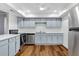 Updated kitchen featuring light blue cabinets and stainless steel appliances at 17920 Gulf Blvd # 205, Redington Shores, FL 33708