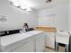Shared laundry room with Maytag washers and dryers, a utility sink, and ample counter space at 17920 Gulf Blvd # 205, Redington Shores, FL 33708