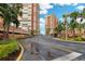 Gated entrance to the community with lush landscaping and parking areas at 17920 Gulf Blvd # 205, Redington Shores, FL 33708