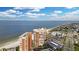 Aerial view of beachfront high-rise building with ocean views, parking, and nearby beach access at 17920 Gulf Blvd # 205, Redington Shores, FL 33708