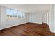 Large bedroom with dark brown wood-look flooring and multiple windows at 17920 Gulf Blvd # 205, Redington Shores, FL 33708