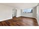 Bright bedroom featuring dark brown wood-look flooring and large windows at 17920 Gulf Blvd # 205, Redington Shores, FL 33708