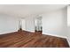 Spacious bedroom with dark brown wood-look flooring and ensuite bathroom access at 17920 Gulf Blvd # 205, Redington Shores, FL 33708