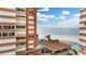 Stunning ocean view from a condo, showcasing a pristine beach, turquoise water, and a resort-style pool at 17920 Gulf Blvd # 205, Redington Shores, FL 33708