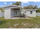 Charming house exterior with screened patio and backyard view at 6810 4Th N Ave, St Petersburg, FL 33710