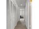 Hallway with white louvered doors and carpet at 5313 Bayshore Blvd # 5313, Tampa, FL 33611