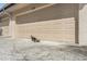 Tan double garage doors with duck Gathering in front at 5313 Bayshore Blvd # 5313, Tampa, FL 33611