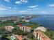 Aerial view showcasing a desirable condo unit with water and community views at 4780 Dolphin Cay S Ln # 501, St Petersburg, FL 33711