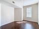 Bright bedroom with hardwood floors and large window at 410 S Armenia Ave # 925, Tampa, FL 33609