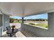 Covered porch with brick wall and view of the neighborhood at 1743 Council Dr, Sun City Center, FL 33573