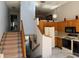 Open kitchen with staircase view and breakfast nook at 1873 Mazo Mnr # T2, Lutz, FL 33558