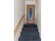 Entryway with carpeted stairs and a front door with a decorative peacock window at 1873 Mazo Mnr # T2, Lutz, FL 33558