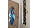Close-up of a stained-glass front door showcasing a peacock design with red roses at 1873 Mazo Mnr # T2, Lutz, FL 33558