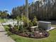 Outdoor seating area with landscaping and patio furniture overlooking the water at 1873 Mazo Mnr # T2, Lutz, FL 33558