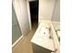 Bathroom featuring a shower, a large white countertop, and neutral paint at 6000 2Nd E St # 6, St Pete Beach, FL 33706