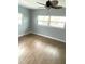 Bedroom with ceiling fan, natural light and hardwood flooring at 6000 2Nd E St # 6, St Pete Beach, FL 33706