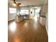 Open-concept living area featuring hardwood floors, and views into the updated kitchen at 6000 2Nd E St # 6, St Pete Beach, FL 33706