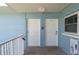 Clean hallway with white doors and fire safety equipment at 6000 2Nd E St # 6, St Pete Beach, FL 33706