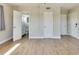 Bedroom with hardwood floors, neutral walls, and access to bathroom at 6000 2Nd E St # 6, St Pete Beach, FL 33706