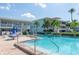 Inviting community pool with plenty of lounge chairs for relaxing at 6000 2Nd E St # 6, St Pete Beach, FL 33706