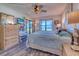 Main bedroom with ocean view and hardwood floors at 900 Gulf Blvd # 205, Indian Rocks Beach, FL 33785