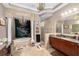 Primary bathroom with soaking tub, double vanity, and large mirror at 918 Shoals Landing Dr, Brandon, FL 33511