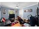 Bedroom with gaming setup, sofa, and tv at 918 Shoals Landing Dr, Brandon, FL 33511