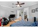 Bedroom with bed, tv, and access to bathroom at 918 Shoals Landing Dr, Brandon, FL 33511