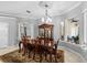 Elegant dining room featuring a large wood table and chandelier at 918 Shoals Landing Dr, Brandon, FL 33511