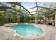 Inviting screened pool and spa with paver deck at 918 Shoals Landing Dr, Brandon, FL 33511