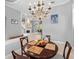 Bright dining room features a round table and chandelier at 918 Shoals Landing Dr, Brandon, FL 33511