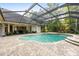 Relaxing screened pool and spa with paver deck at 918 Shoals Landing Dr, Brandon, FL 33511