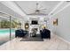 Living room with fireplace, pool view, and two sofas at 918 Shoals Landing Dr, Brandon, FL 33511