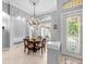 Charming dining area with a round table and decorative chandelier at 918 Shoals Landing Dr, Brandon, FL 33511