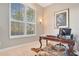 Office space featuring a large window, a classic desk, and a unique bear skin rug on the floor at 1935 Lago Vista Blvd, Palm Harbor, FL 34685