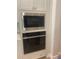Built-in microwave and oven with sleek stainless steel finish at 4817 Majestic Hills Loop, Brooksville, FL 34601