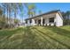 House with backyard and covered patio at 4817 Majestic Hills Loop, Brooksville, FL 34601