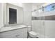 Modern bathroom featuring sleek vanity, glass-enclosed shower, and bright lighting at 4817 Majestic Hills Loop, Brooksville, FL 34601
