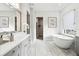Serene bathroom featuring soaking tub, quartz countertops, and soft color palette at 4817 Majestic Hills Loop, Brooksville, FL 34601