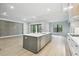 Spacious kitchen featuring an oversized island, modern appliances, and seamless flow into the living space at 4817 Majestic Hills Loop, Brooksville, FL 34601