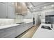 Modern kitchen with gray cabinets, white countertops, and stainless steel appliances at 4817 Majestic Hills Loop, Brooksville, FL 34601