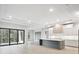 Spacious kitchen featuring an oversized island, modern appliances, and seamless flow into the living space at 4817 Majestic Hills Loop, Brooksville, FL 34601
