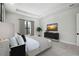 Spacious main bedroom featuring tray ceiling, neutral decor, and large windows at 4817 Majestic Hills Loop, Brooksville, FL 34601